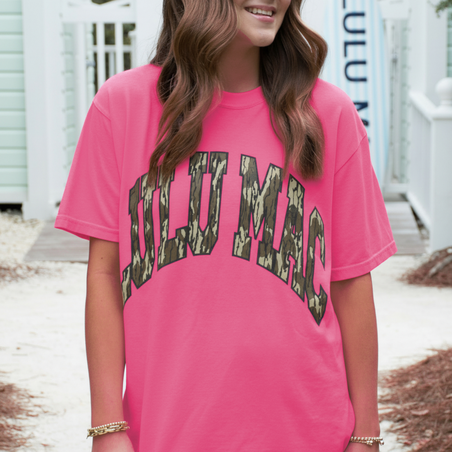 Neon pink camo graphic tee for women featuring Mossy Oak Bottomland print on Comfort Colors shirt
